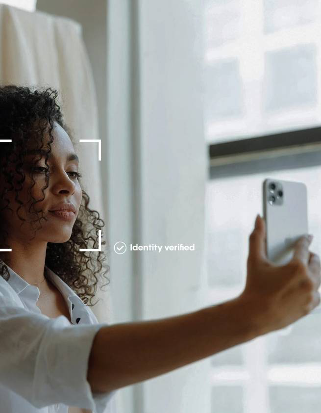Person verifying identity with a selfie